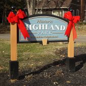 Highland Park sign decoorated for Christmas.