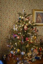 Carolyn puts a smaller tree upstairs. It's filled with treasures and curiosities.